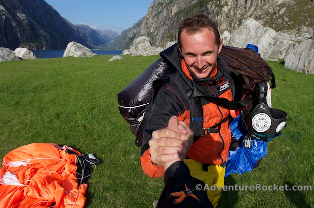 Base jumper happy handshake at landing zone