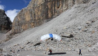 Successful landing after base jumping the 600m high east wall of the 5100m high Pan de Azucar